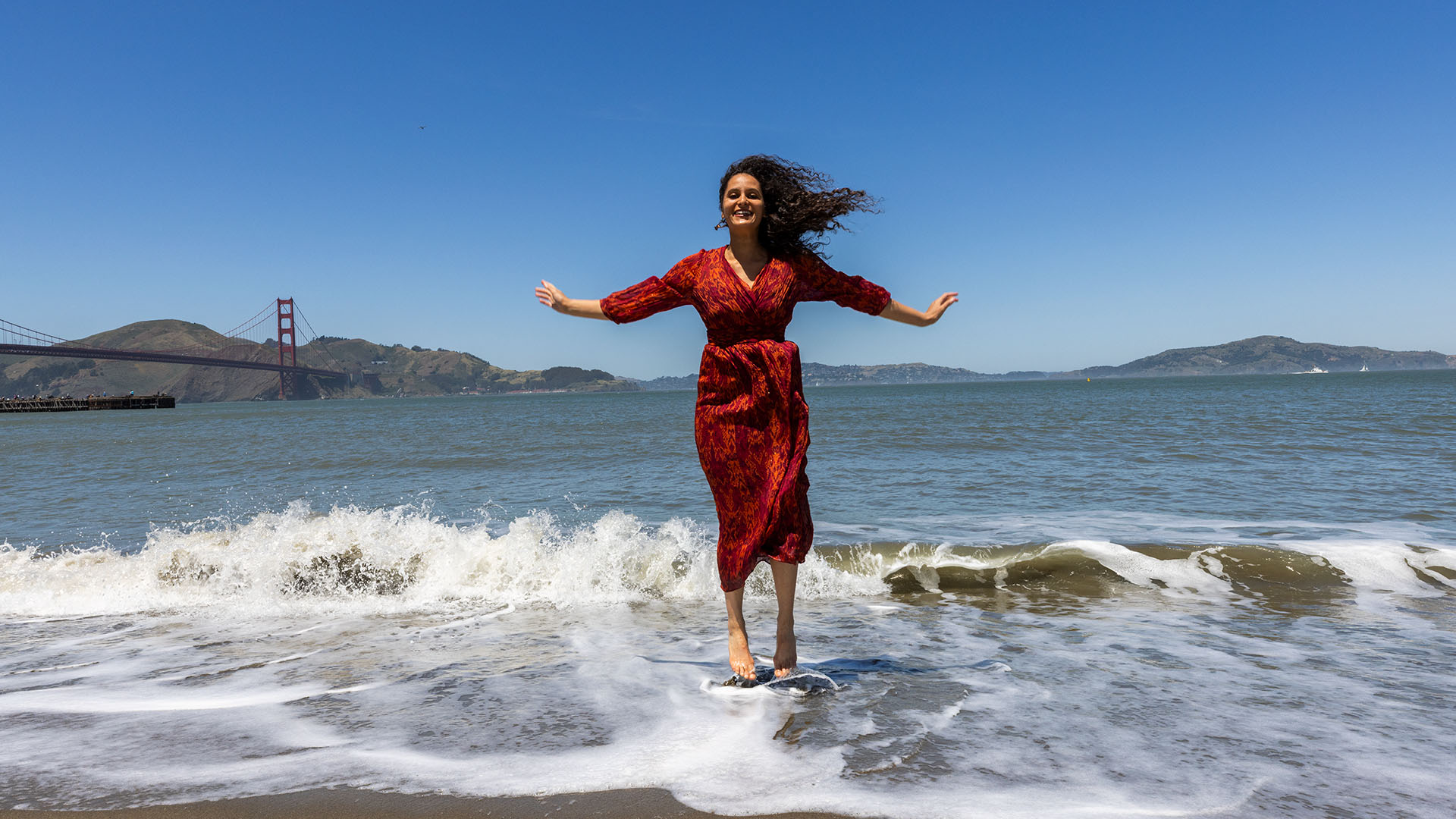 Amber Jumping For Joy at Crissy Beach in San Francisco, CA